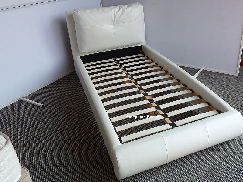single white leather bed with mattress